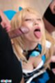 On her knees eyes closed tongue out cum on her face