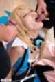 Licking spent cock cum on her face