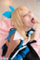 Mizuki on her knees eyes closed tongue extended cum on her face