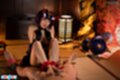 Seated with ankles bound giving footjob