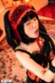 Kneeling wearing red lingerie
