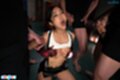 On her knees top raised over her tits surrounded by cocks