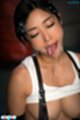 Licking cum from her face