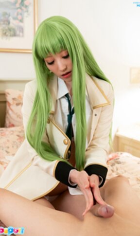 Mizuki lying on bed giving breast sex and handjob