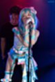 Hands wrapped around microphone fondled from behind