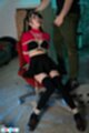 Tied to chair thighs pressed together