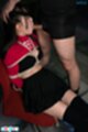 Tied to chair red top raised over bra wearing black skirt sucking cock
