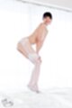 Anna matsuda bending over hands on her knees wearing stockings garter belt high heels
