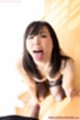 On her knees tongue out wearing black stockings