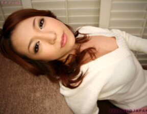 Akari Sana in black underwear and stockings and on her knees sucking cock