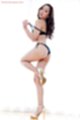 Pulling bra off long hair down her back gold high heels