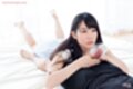 Giving handjob on her front long hair falling over her shoulder