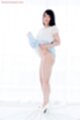 Raising dress wearing high heels