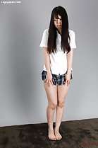 Standing barefoot in students uniform short skirt long hair