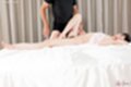 Lying on her back knee raised giving leg sex