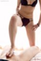 Hand on her thigh in bra and panties  giving footjob bare feet