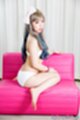 Kneeling on chair wearing bra and panties bare feet.jpeg