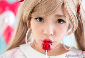Rika Mari in pigtails licking lollipop and hard cock