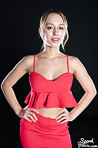 Wearing red skirt hands on hips