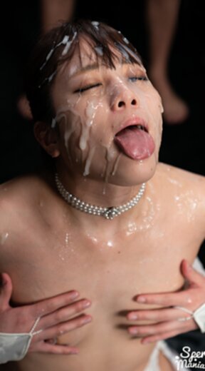 Komatsu Aya kneeling nude wearing stockings receiving bukkake facials