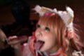 Misa holding cock tongue out looking up