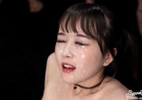 Kurumi Ria seated naked surrounded by men bukkake facial cumshots