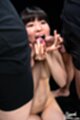 On her knees nude licking cocks
