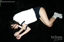 Student Kawai Anri lying on floor in her gym class uniform