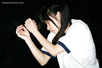 Lying on floor with eyes closed arms raised long hair gym class uniform
