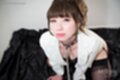 Katou tsubaki kneeling wearing bondage chain in white jacket black stockings