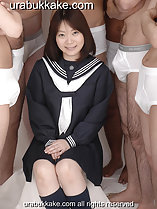 Sitting between semi naked men kogal in uniform hands resting on her lap