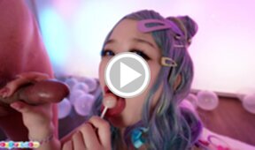 Ria Kurumi sucking lollipop while giving handjob
